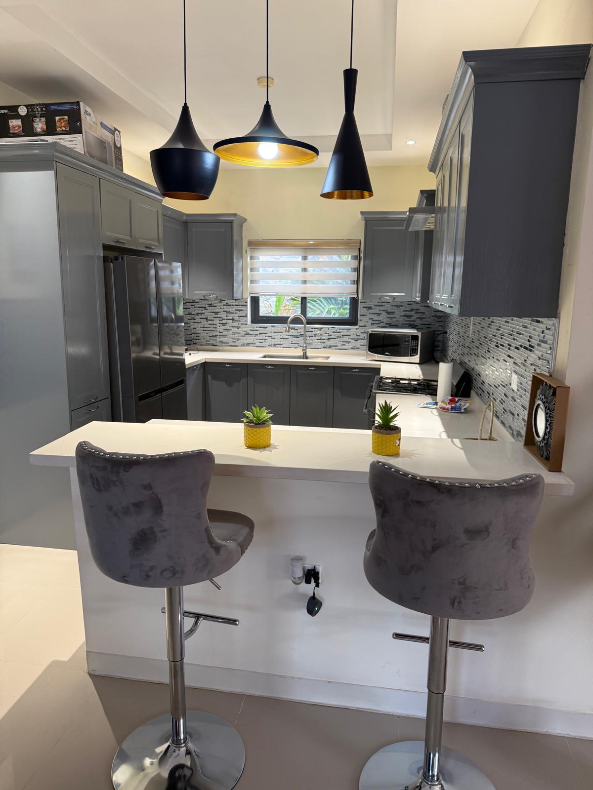 Kitchen and breakfast bar inside the villa
